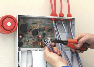 Fire-alarm-engineer-working-1400x400